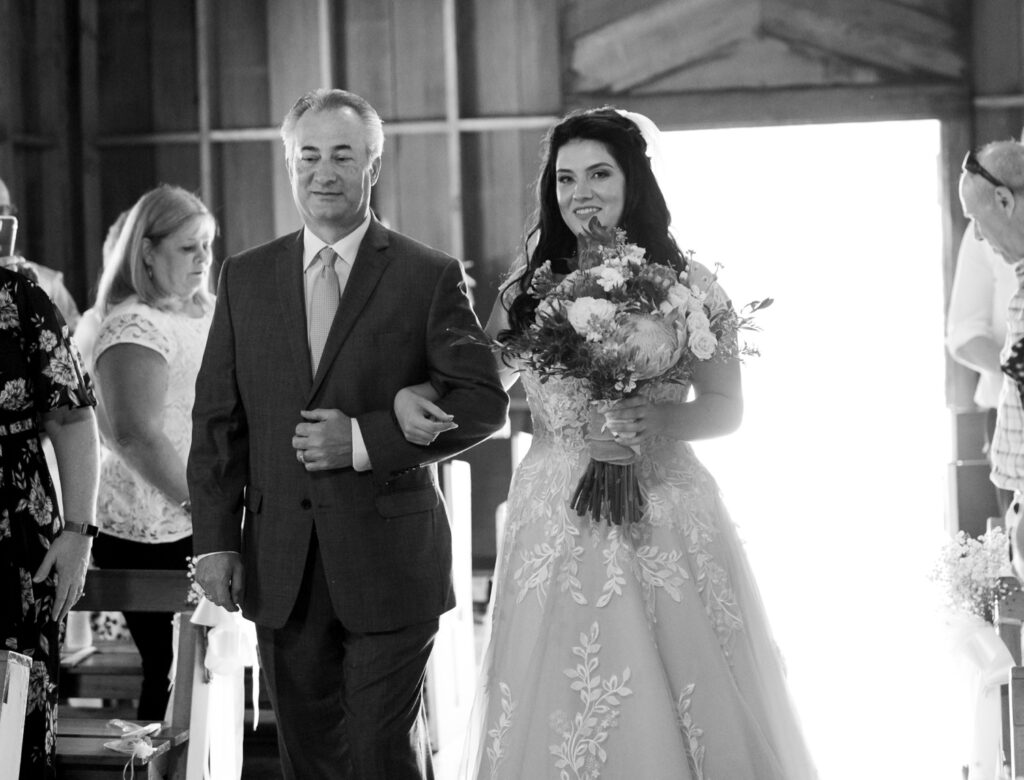 Bride walking down aisle with dad													